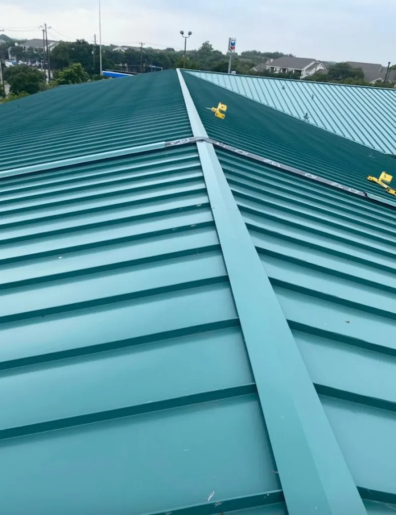 Green commercial metal roof ridge and valley for Metal Roof Repair in Dodgeville